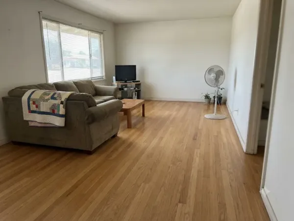 Refinished oak strip floor in a Greenacres, CA living room